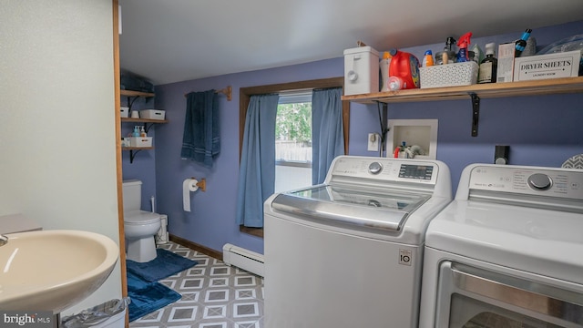 718 Walnut St, Royersford, PA 19468 - laundry room featuring separate washer and dryer, baseboard heating, tile patterned floors, and baseboards