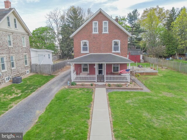 718 Walnut St, Royersford, PA 19468 - view of front of home with central AC unit, a chimney, a porch, and driveway