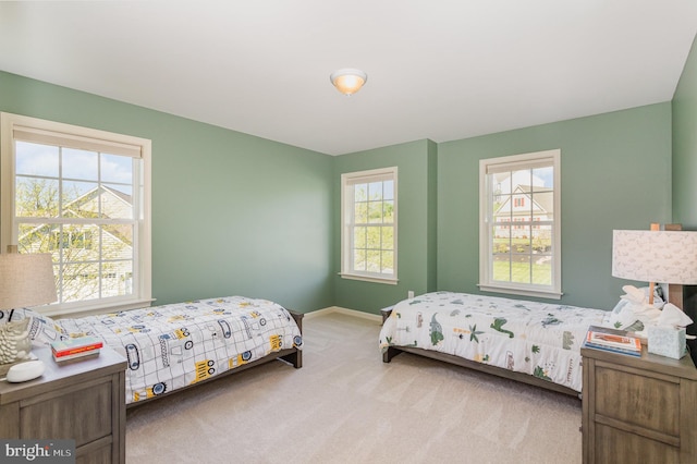 bedroom with carpet flooring and baseboards