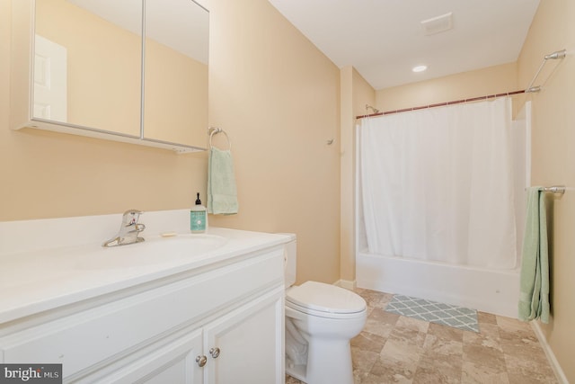 bathroom with toilet, shower / bath combo, and vanity