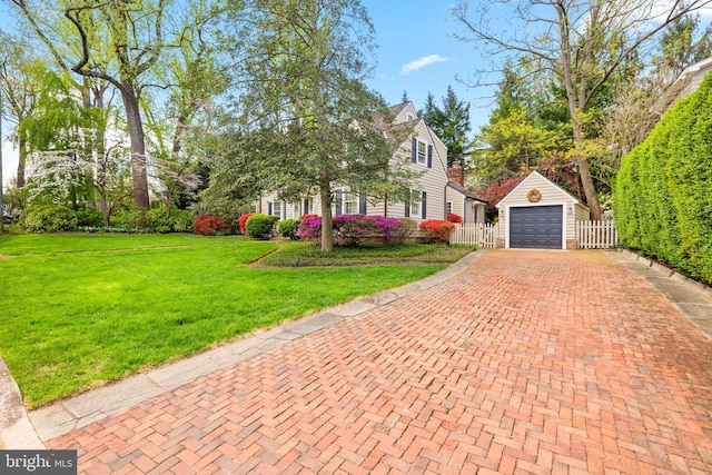3614 N Abingdon St, Arlington, VA 22207 - view of front facade featuring decorative driveway, an outdoor structure, and a detached garage