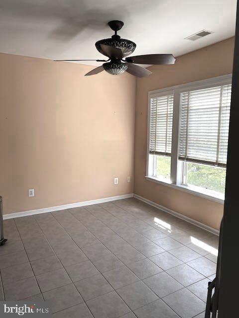 1402 Joppa Forest Dr Unit 12, Joppa, MD 21085 - unfurnished room featuring baseboards, ceiling fan, tile patterned flooring, and visible vents