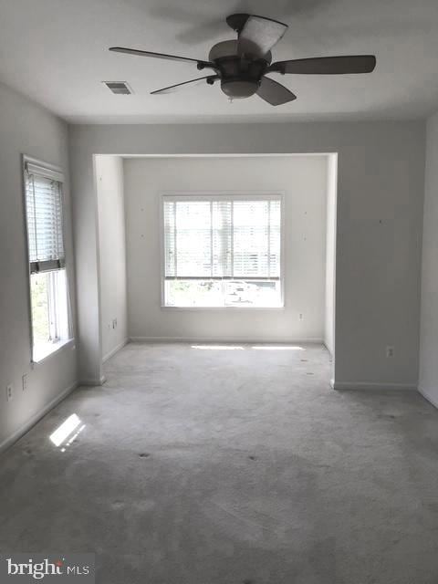 1402 Joppa Forest Dr Unit 12, Joppa, MD 21085 - carpeted spare room with visible vents, a ceiling fan, and baseboards