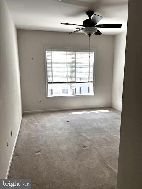 1402 Joppa Forest Dr Unit 12, Joppa, MD 21085 - carpeted spare room with baseboards and ceiling fan