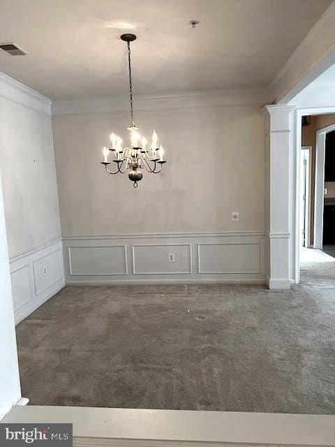 1402 Joppa Forest Dr Unit 12, Joppa, MD 21085 - unfurnished dining area with an inviting chandelier, ornamental molding, carpet, and a decorative wall