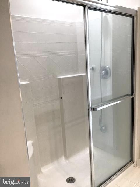 1402 Joppa Forest Dr Unit 12, Joppa, MD 21085 - bathroom featuring tile patterned flooring and a stall shower