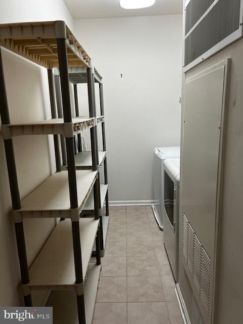 1402 Joppa Forest Dr Unit 12, Joppa, MD 21085 - laundry area with baseboards, laundry area, washing machine and dryer, and light tile patterned floors