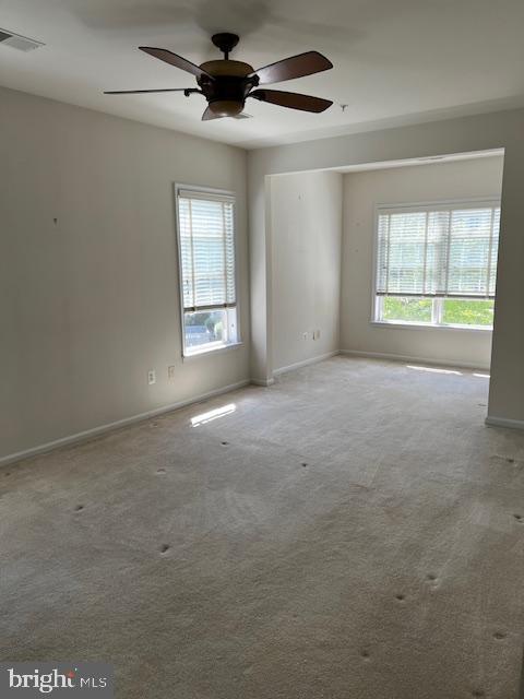 1402 Joppa Forest Dr Unit 12, Joppa, MD 21085 - carpeted empty room featuring baseboards, visible vents, and a wealth of natural light