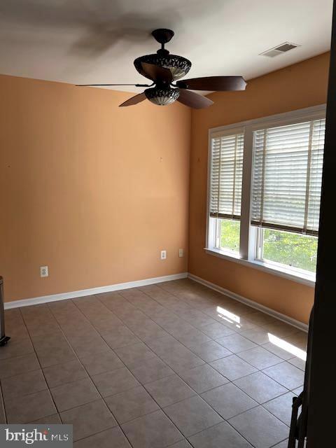 1402 Joppa Forest Dr Unit 12, Joppa, MD 21085 - spare room with ceiling fan, tile patterned floors, visible vents, and baseboards