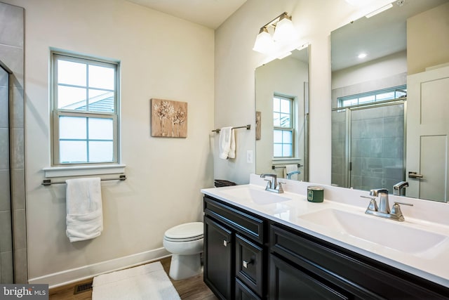 9008 Waller Tree Way, Upper Marlboro, MD 20772 - bathroom with toilet, a sink, tiled shower, and baseboards