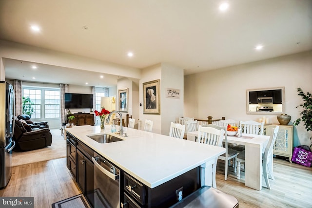 9008 Waller Tree Way, Upper Marlboro, MD 20772 - kitchen with light wood-style floors, open floor plan, appliances with stainless steel finishes, and a sink