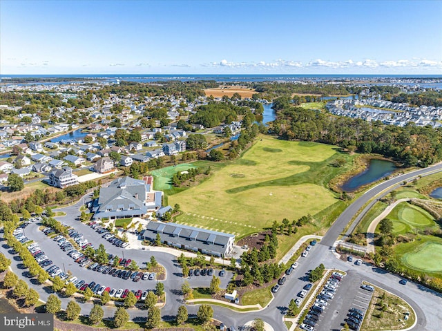bird's eye view featuring a water view, a residential view, and golf course view