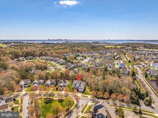 aerial view with a water view and a residential view