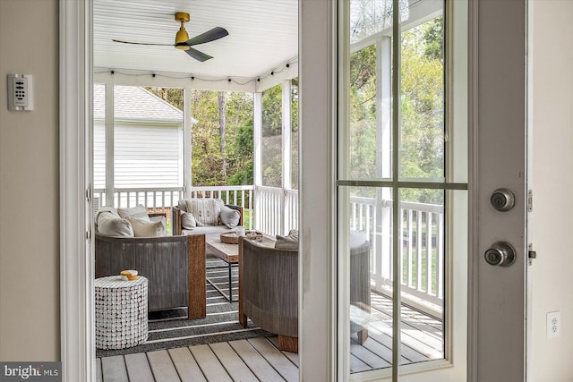 entryway with a ceiling fan, wood finished floors, and a wealth of natural light