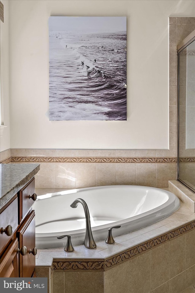 full bathroom with a bath