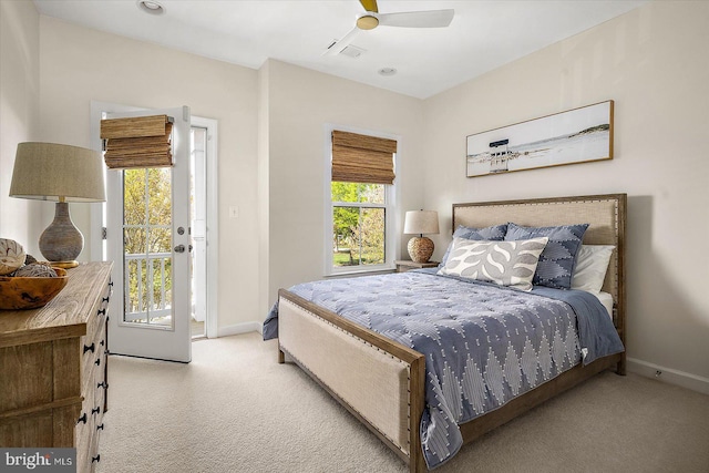 carpeted bedroom with baseboards, ceiling fan, access to outside, and visible vents