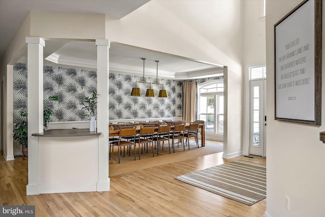 entrance foyer featuring crown molding and wood finished floors
