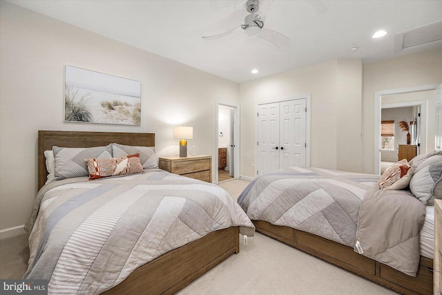 carpeted bedroom featuring a closet, baseboards, attic access, ceiling fan, and recessed lighting