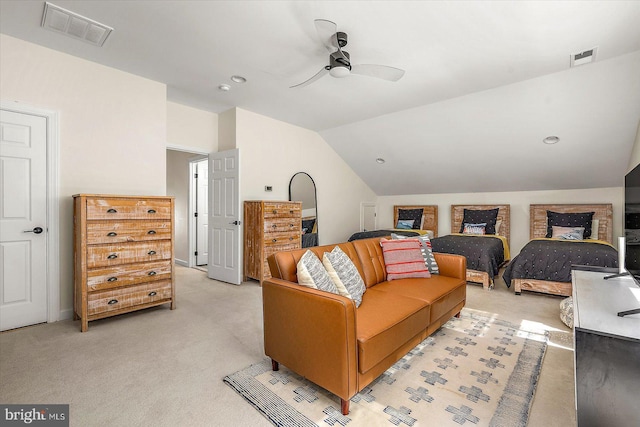 bedroom featuring light colored carpet, a ceiling fan, visible vents, and lofted ceiling