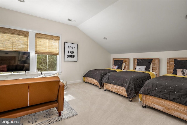 carpeted bedroom with visible vents, baseboards, and vaulted ceiling