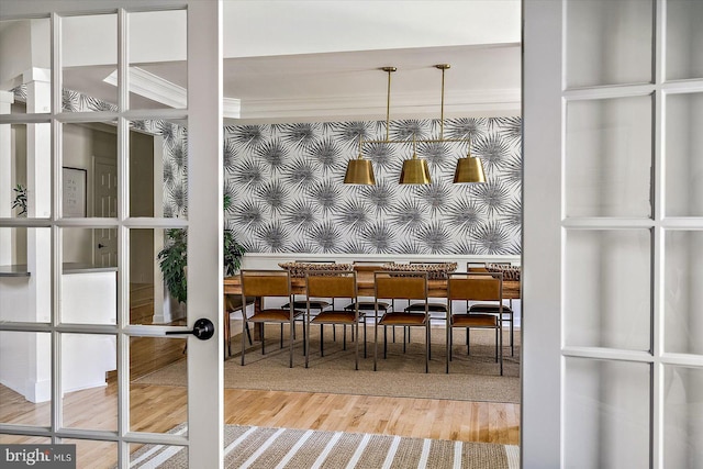 dining room featuring french doors and wood finished floors
