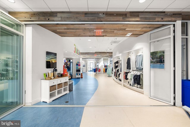 interior space with baseboards and recessed lighting
