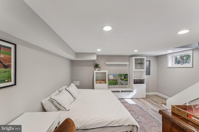 bedroom with recessed lighting, baseboards, and light wood-type flooring