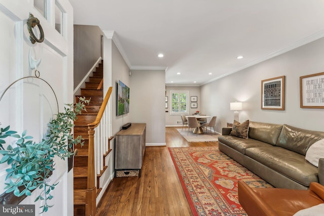 living room with recessed lighting, ornamental molding, dark wood-style flooring, and stairs