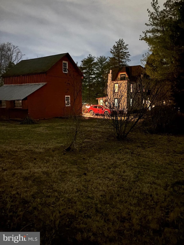 view of yard featuring a barn and an outdoor structure