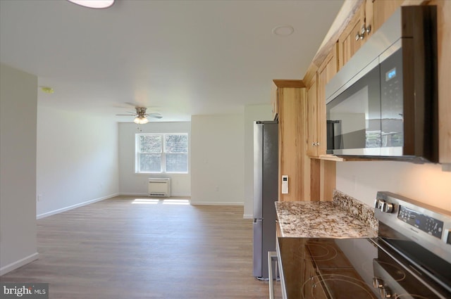 3497 New Lancaster Valley Rd, Milroy, PA 17063 - kitchen featuring stainless steel appliances, light brown cabinets, ceiling fan, light wood-type flooring, and baseboards