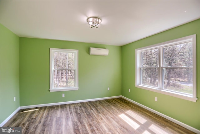 3497 New Lancaster Valley Rd, Milroy, PA 17063 - unfurnished room with a wall unit AC, a wealth of natural light, and baseboards
