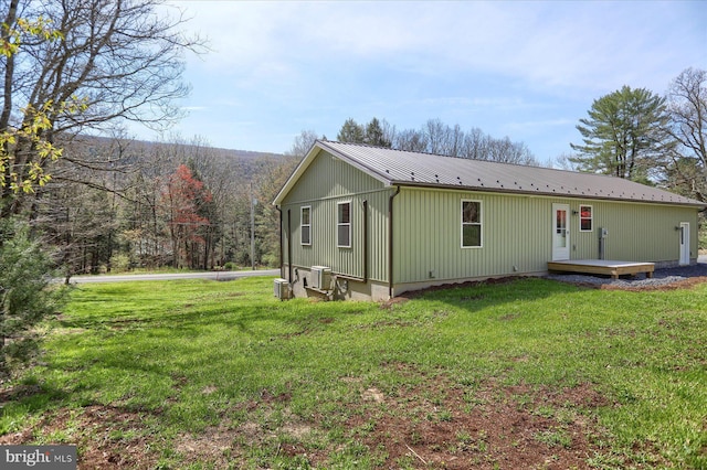 3497 New Lancaster Valley Rd, Milroy, PA 17063 - exterior space featuring a deck, central AC, a front lawn, and metal roof