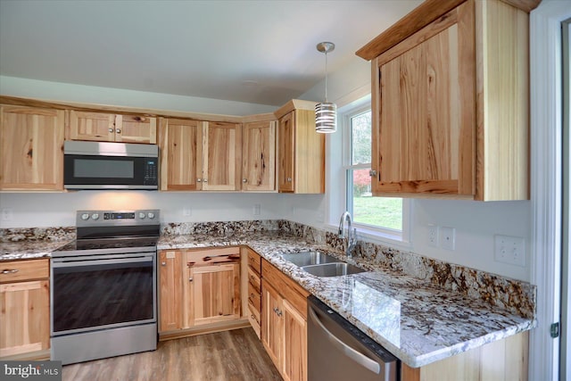 3497 New Lancaster Valley Rd, Milroy, PA 17063 - kitchen featuring light brown cabinets, appliances with stainless steel finishes, light wood finished floors, and a sink