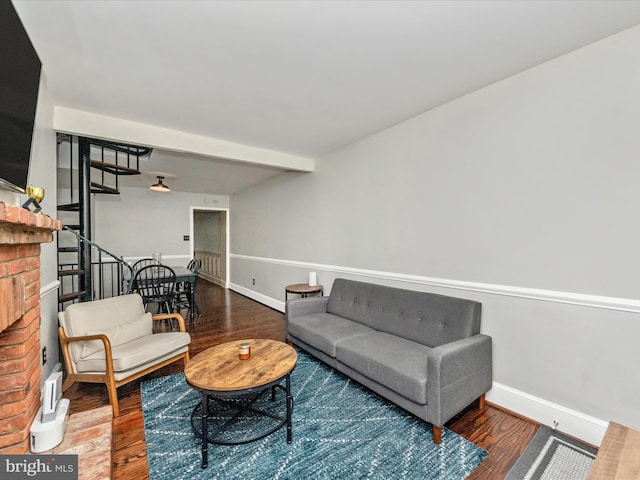 23 E Wheeling St, Baltimore, MD 21230 - living area featuring baseboards, a brick fireplace, and wood finished floors