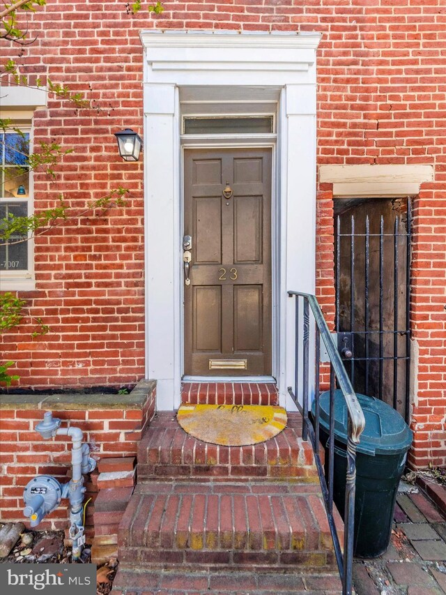 23 E Wheeling St, Baltimore, MD 21230 - doorway to property with brick siding