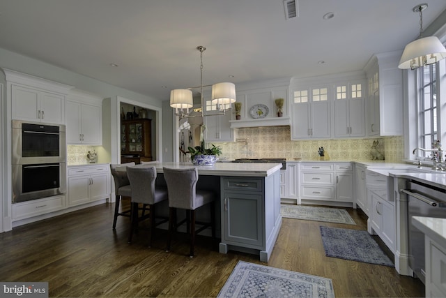 kitchen with visible vents, light countertops, appliances with stainless steel finishes, and white cabinets