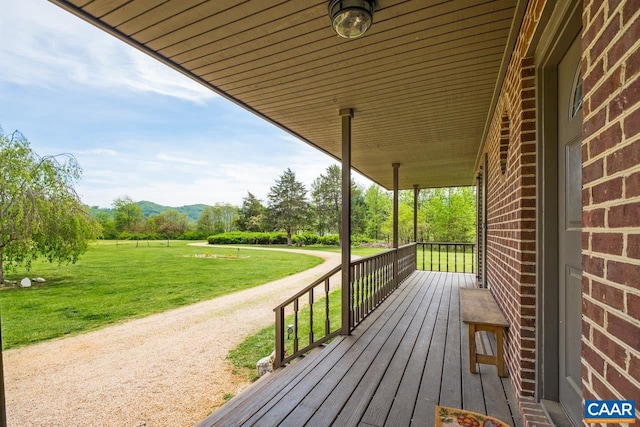 72 Katies Way, Nellysford, VA 22958 - wooden deck featuring a lawn, a mountain view, and covered porch