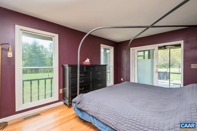 72 Katies Way, Nellysford, VA 22958 - bedroom with visible vents, baseboards, wood finished floors, and access to outside