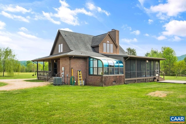 72 Katies Way, Nellysford, VA 22958 - rear view of property with central AC, brick siding, a sunroom, a chimney, and a lawn