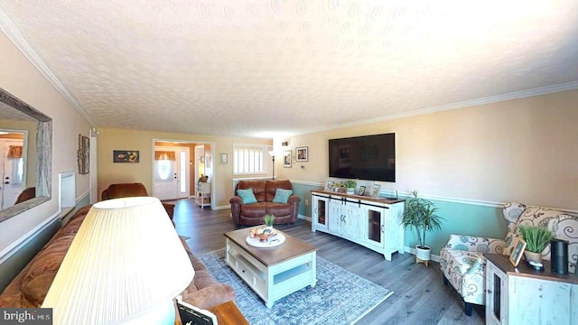 1550 Beacon St, Keyser, WV 26726 - living area with a textured ceiling, baseboards, ornamental molding, and wood finished floors