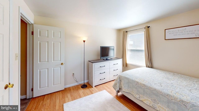 1550 Beacon St, Keyser, WV 26726 - bedroom with baseboards and light wood-style flooring