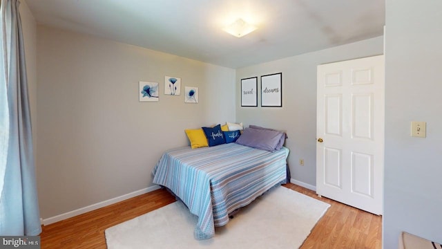 1550 Beacon St, Keyser, WV 26726 - bedroom with baseboards and light wood-style flooring