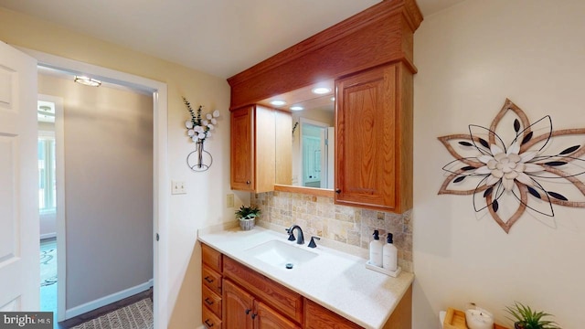 1550 Beacon St, Keyser, WV 26726 - bathroom with vanity and decorative backsplash