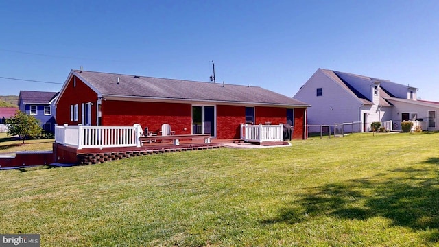 1550 Beacon St, Keyser, WV 26726 - rear view of property with a lawn, fence, a deck, and brick siding
