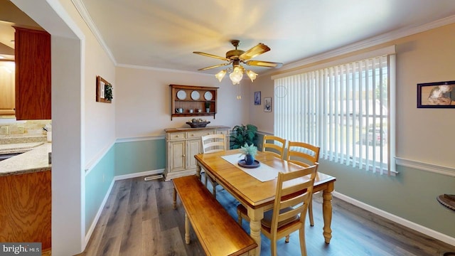 1550 Beacon St, Keyser, WV 26726 - dining room with dark wood-style flooring, ceiling fan, ornamental molding, and a wealth of natural light