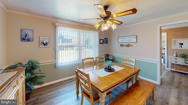 1550 Beacon St, Keyser, WV 26726 - dining space with a ceiling fan, baseboards, ornamental molding, and wood finished floors