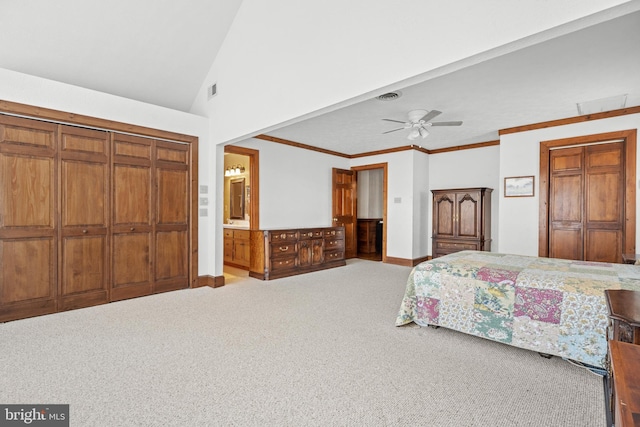 carpeted bedroom featuring baseboards, vaulted ceiling, visible vents, and crown molding