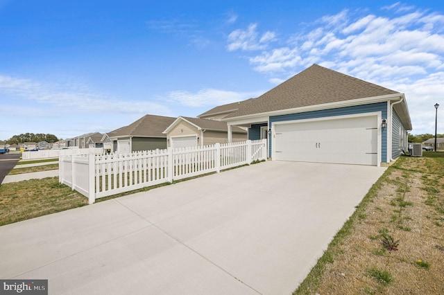 10883 Farmerfield St, Milford, DE 19963 - single story home featuring central AC, concrete driveway, fence, an attached garage, and a shingled roof