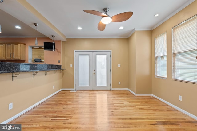 4626 Kavon Ave, Baltimore, MD 21206 - interior space with french doors, baseboards, ceiling fan, crown molding, and light wood-style floors