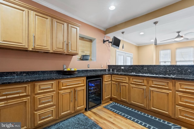 4626 Kavon Ave, Baltimore, MD 21206 - kitchen featuring wine cooler, decorative light fixtures, ornamental molding, light wood finished floors, and dark stone counters
